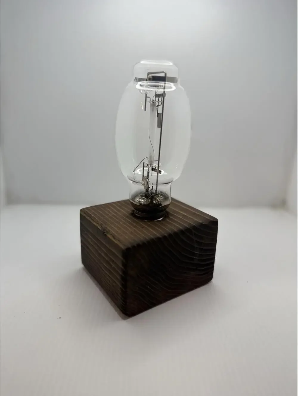 Vintage Retro High Pressure Sodium Industrial Bulb Display on Wood Pedestal